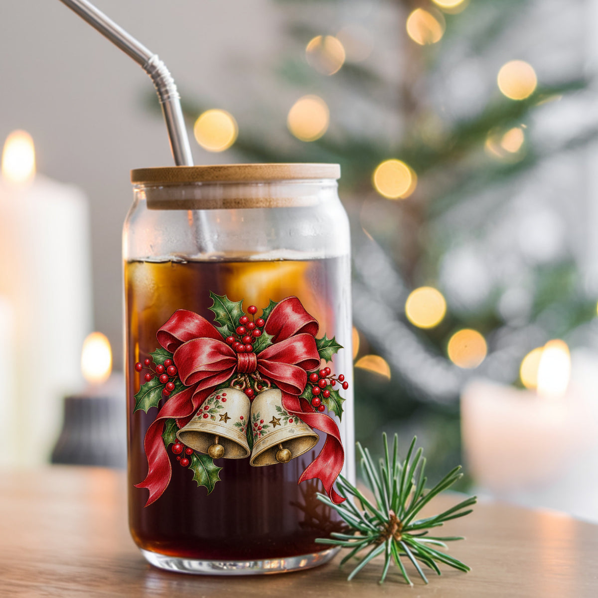 Christmas Bells With Red Bow UV DTF sticker applied to a glass can cup of iced coffee with a straw