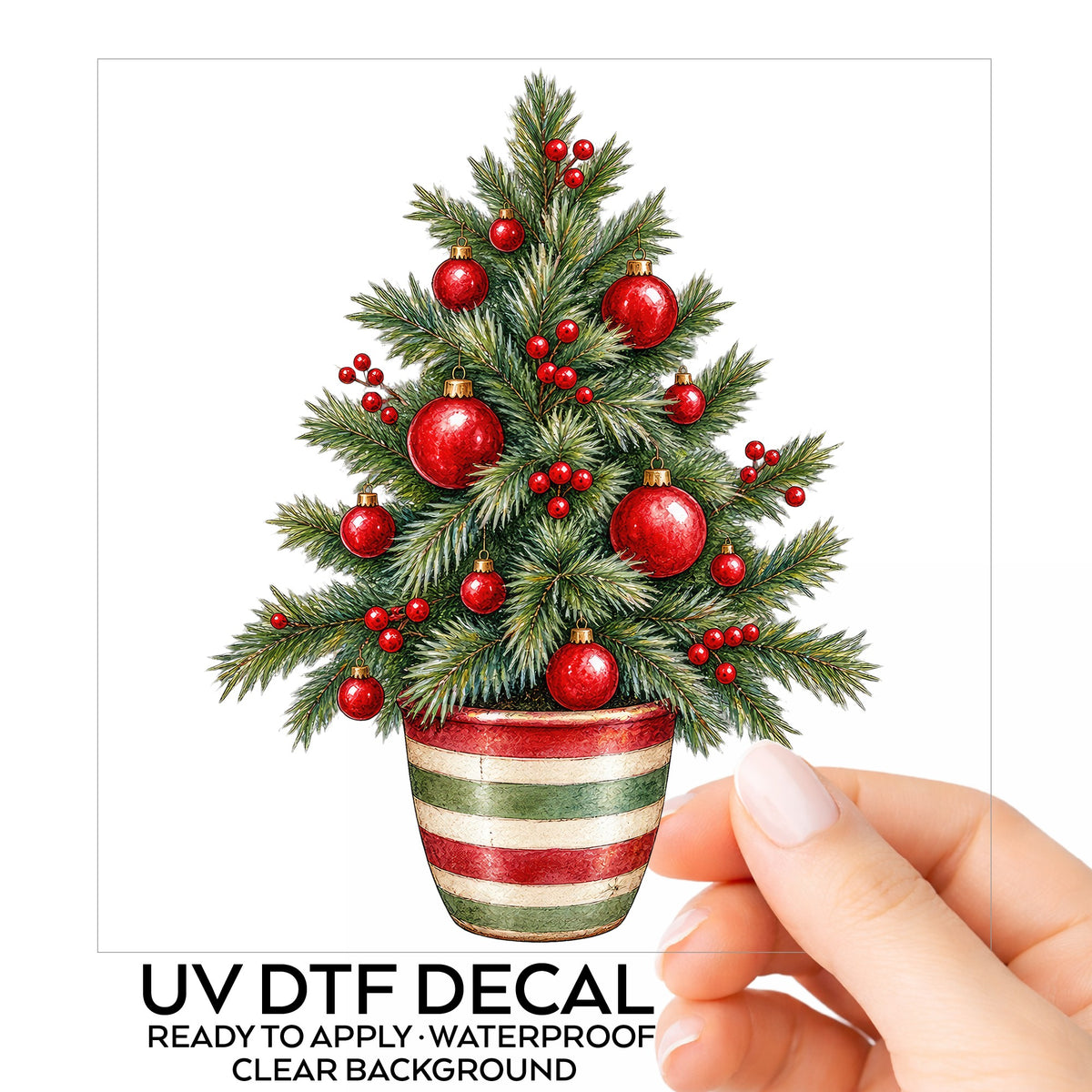 Potted Christmas Tree With Red Ornaments UV DTF sticker on its backing card, held in hand
