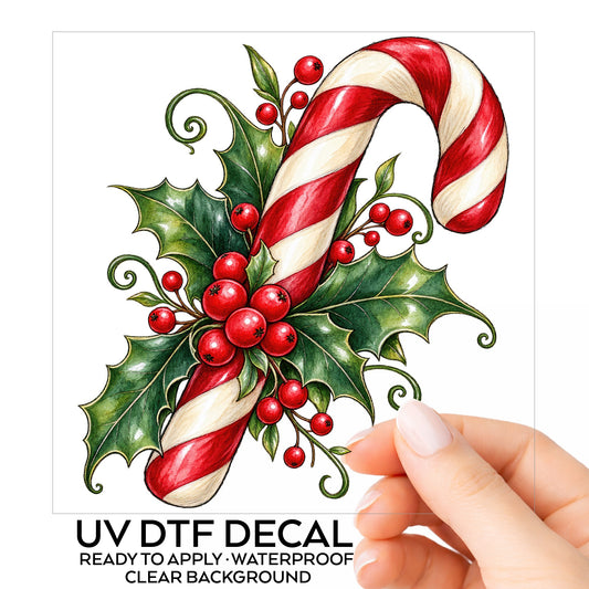 Candy Cane With Holly UV DTF sticker on its backing card, held in hand