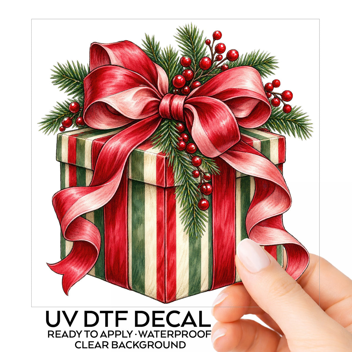 Striped Christmas Gift Box UV DTF sticker on its backing card, held in hand