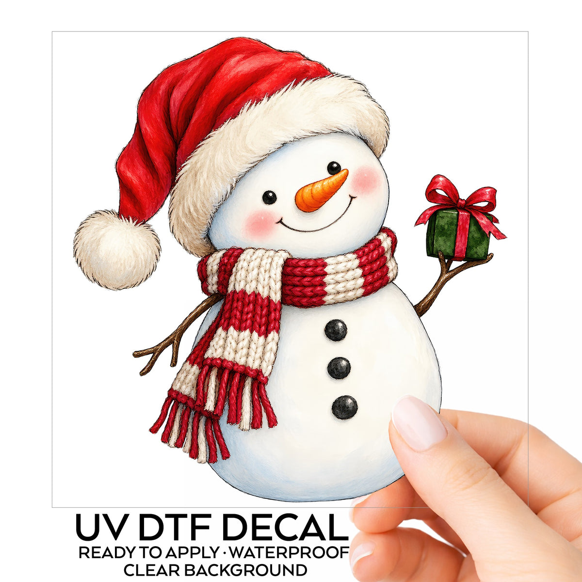 Snowman In Santa Hat With Gift UV DTF sticker on its backing card, held in hand