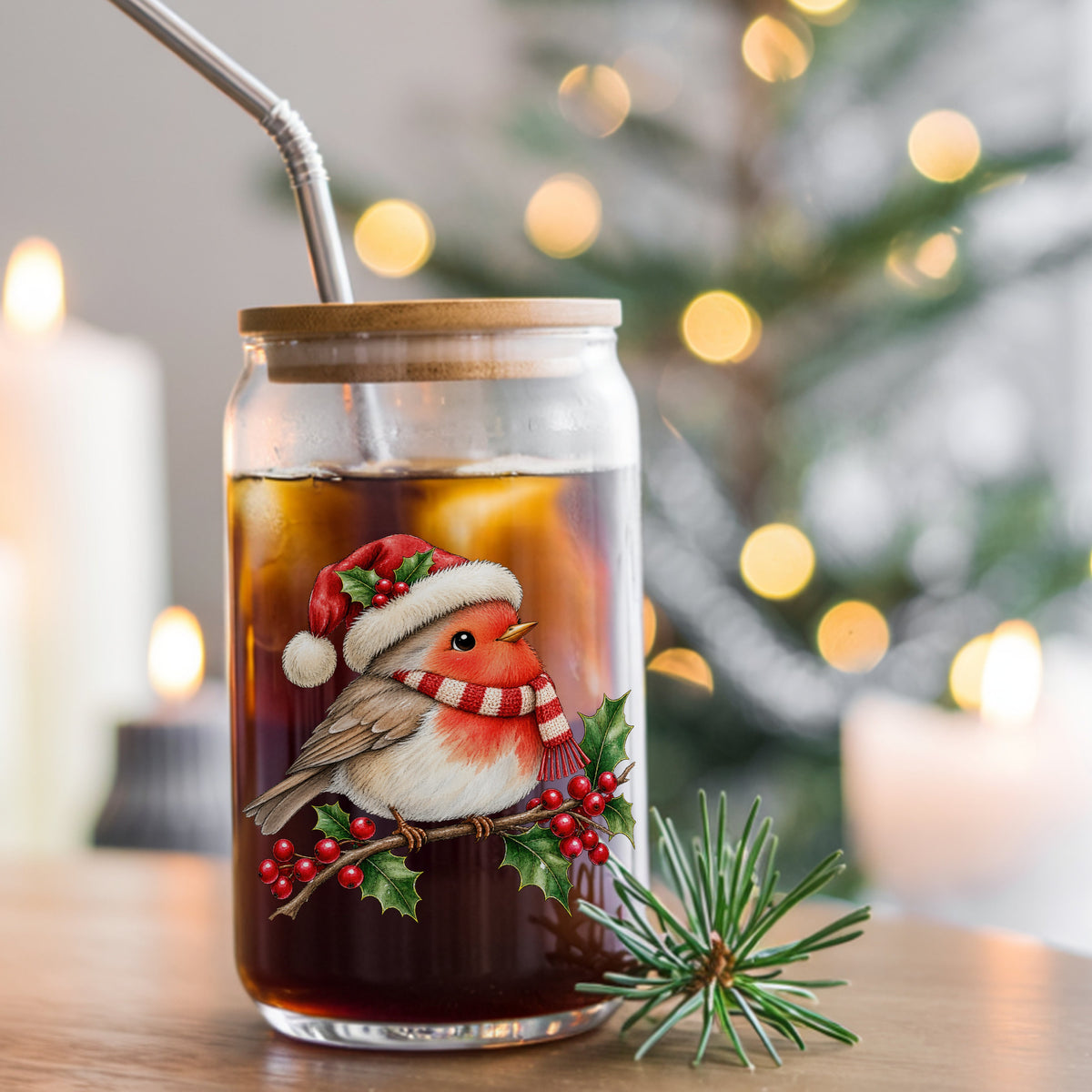 Robin In Santa Hat On Holly Branch UV DTF sticker applied to a glass can cup of iced coffee with a straw