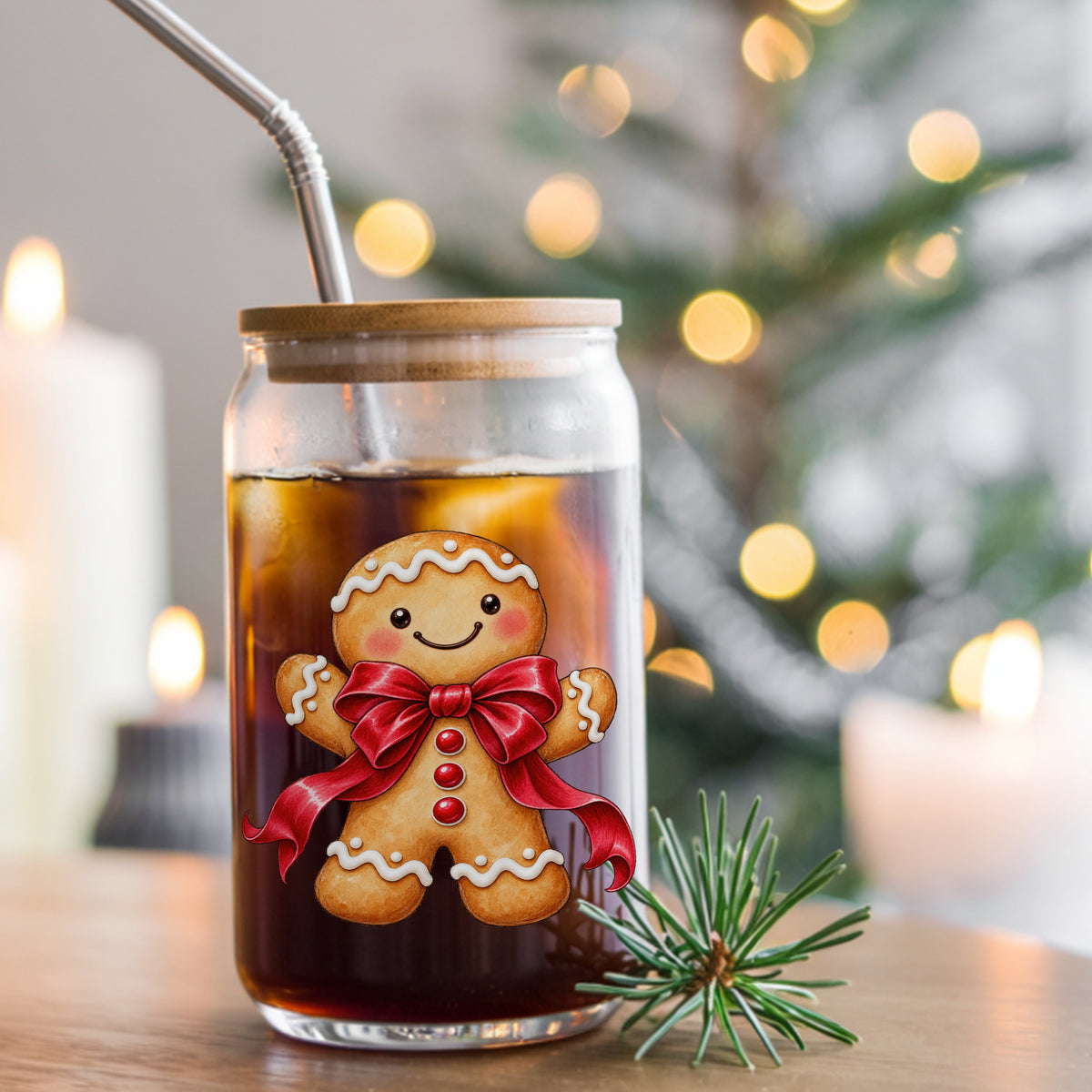 Gingerbread Man With Red Bow UV DTF sticker applied to a glass can cup of iced coffee with a straw