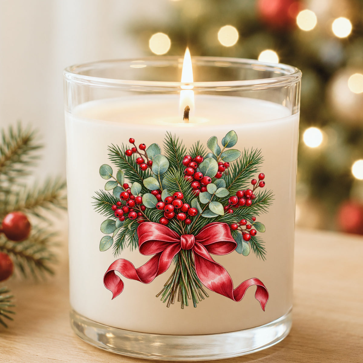 Winter Berry Bouquet With Red Bow UV DTF sticker applied to a white candle in a glass holder near Christmas lights