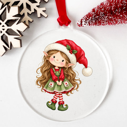 Christmas Elf Girl With Long Hair UV DTF sticker applied to a clear round acrylic ornament with a red ribbon