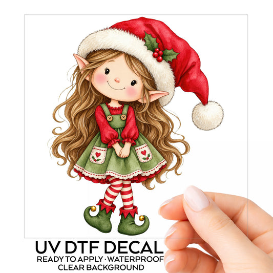 Christmas Elf Girl With Long Hair UV DTF sticker on its backing card, held in hand