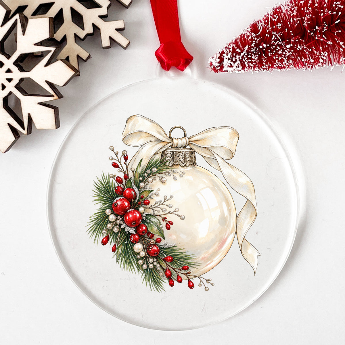 Cream Glass Ornament With Ribbon UV DTF sticker applied to a clear round acrylic ornament with a red ribbon