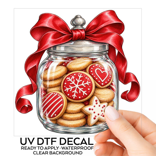 Christmas Cookie Jar UV DTF sticker on its backing card, held in hand