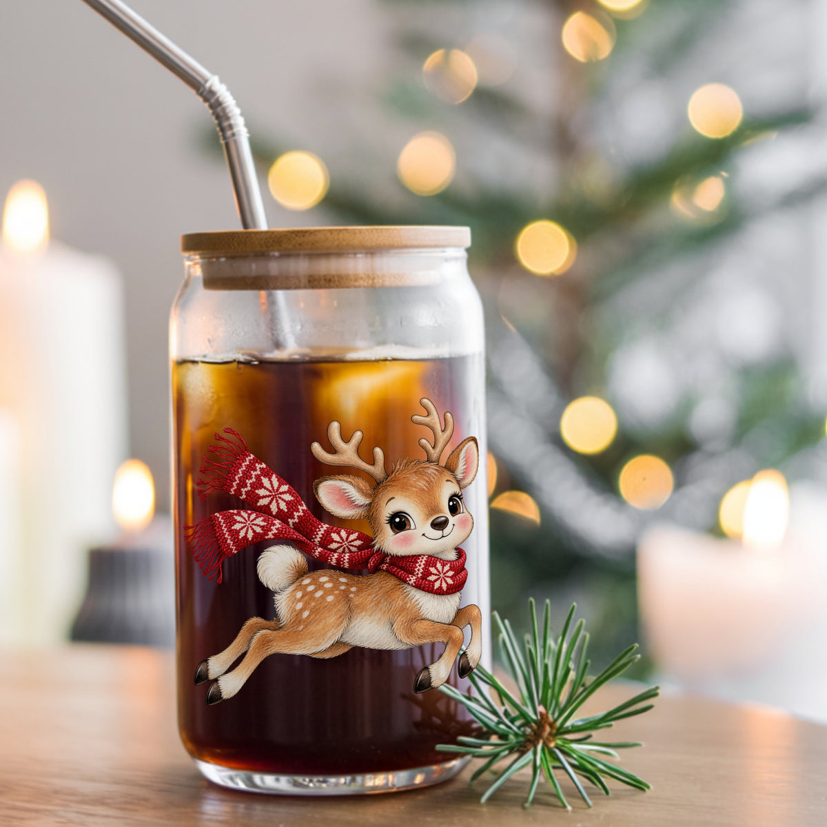 Leaping Reindeer In Nordic Scarf UV DTF sticker applied to a glass can cup of iced coffee with a straw