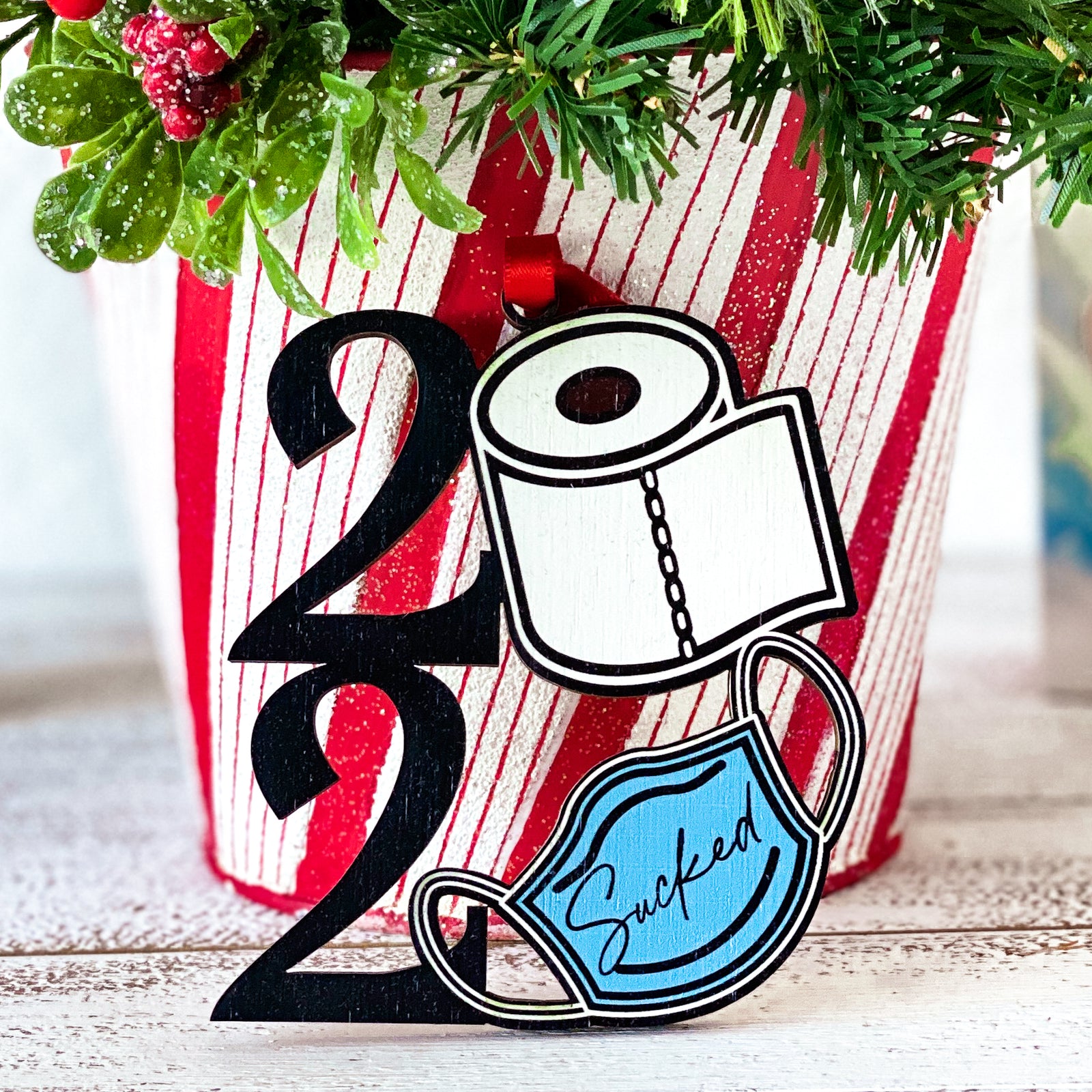 2020 Sucked. For One 0 a roll of toilet paper, the other is a mask.